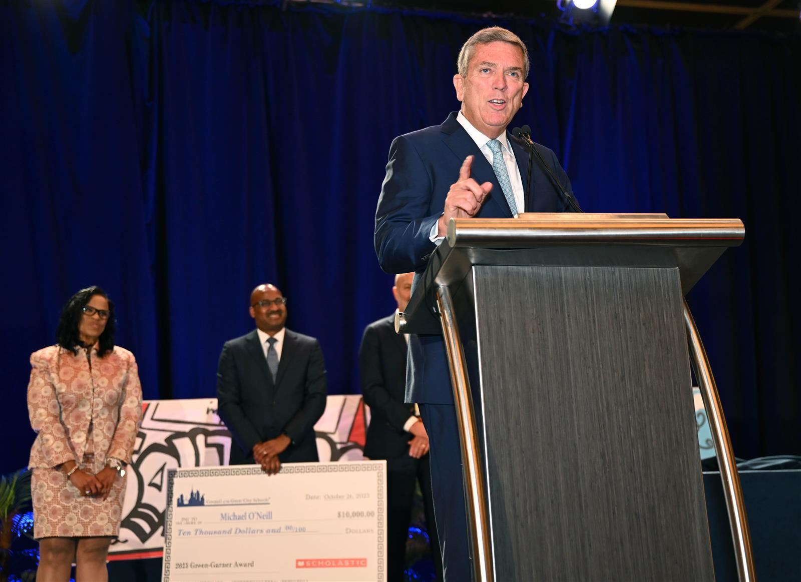 Boston School Board Member, Michael O'Neill accepting the 2023 Green-Garner Award at the CGCS Annual Fall Conference in CA.